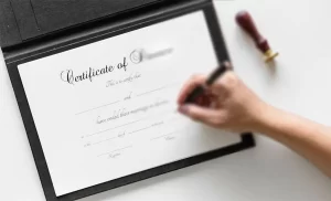 NGO registration in Kenya - hand signing a certificate